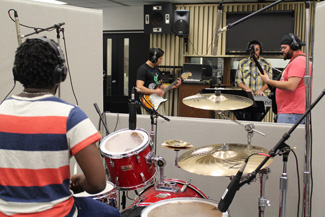 Music band practice in studio hall