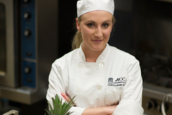A woman in a chefs hat
