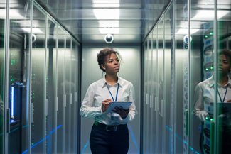 Computer analyst in server room