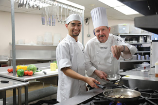 Chef and student preparing to cook