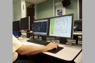 Person at computer working on drafting design