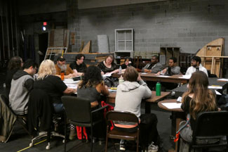 Cast members in rehearsal