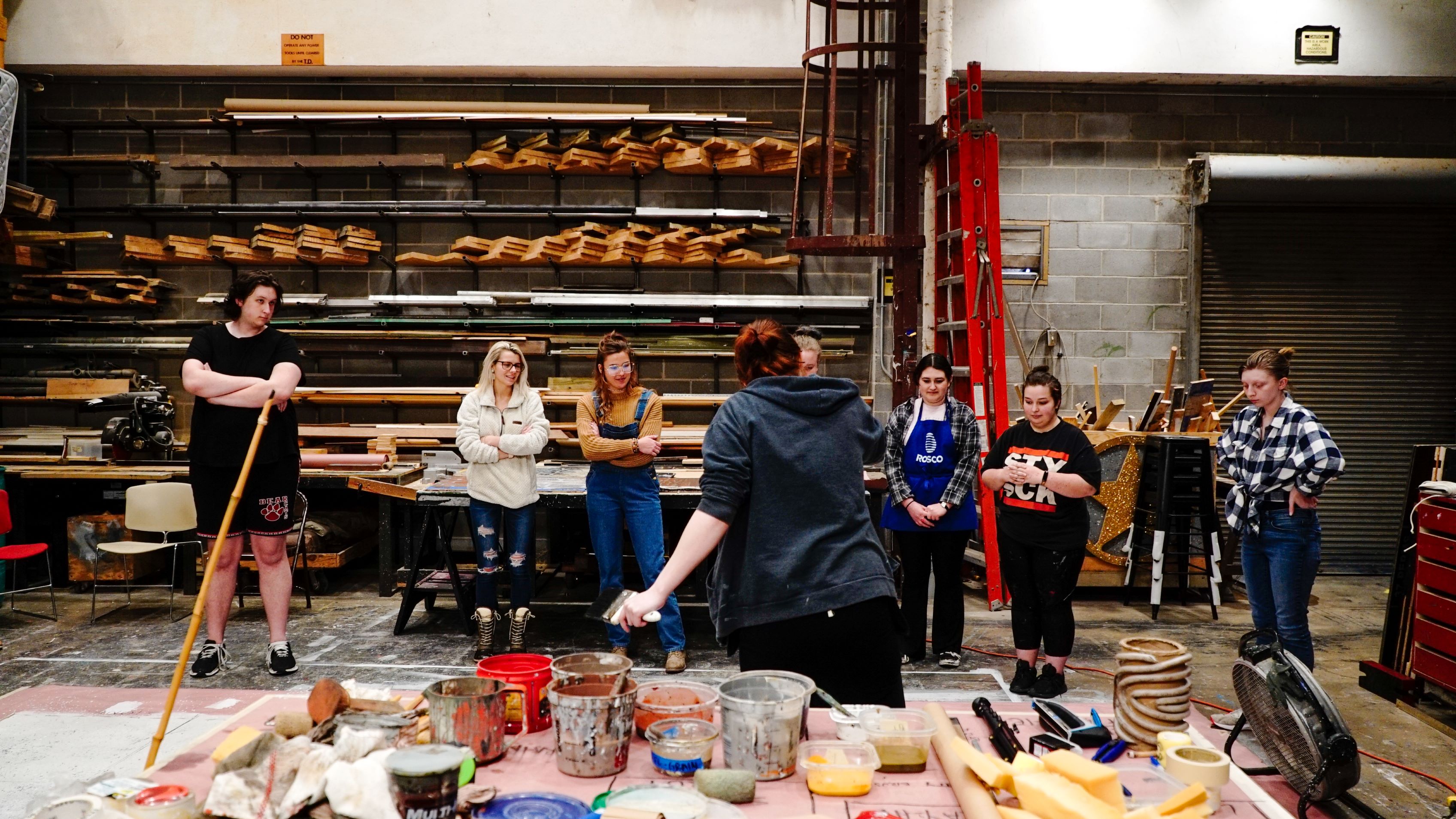 Students in a scenic painting workshop