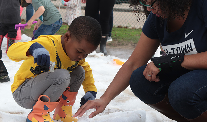 Mom and son making snow balls