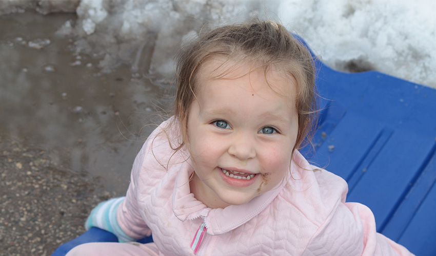 Little girl smiling at the camera