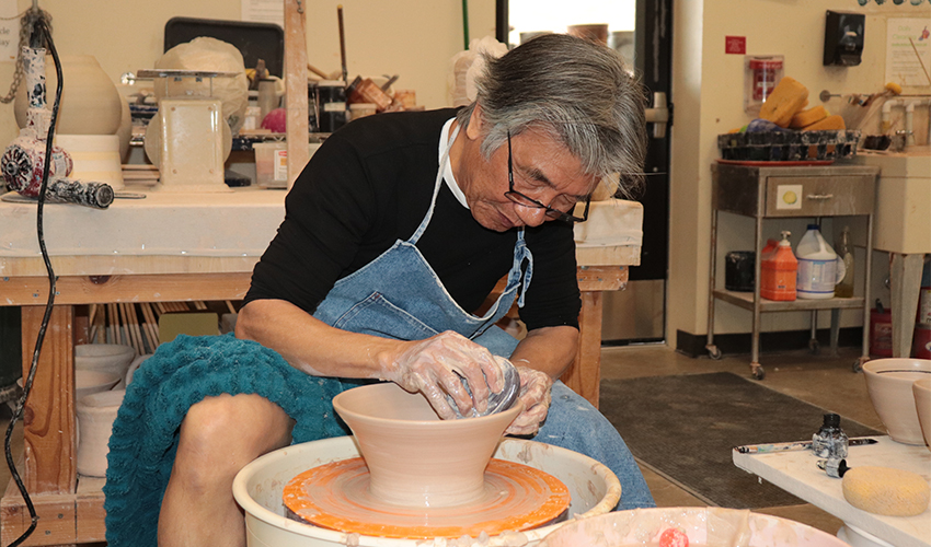 Mr. V. Chin making a big ceramic bowl.