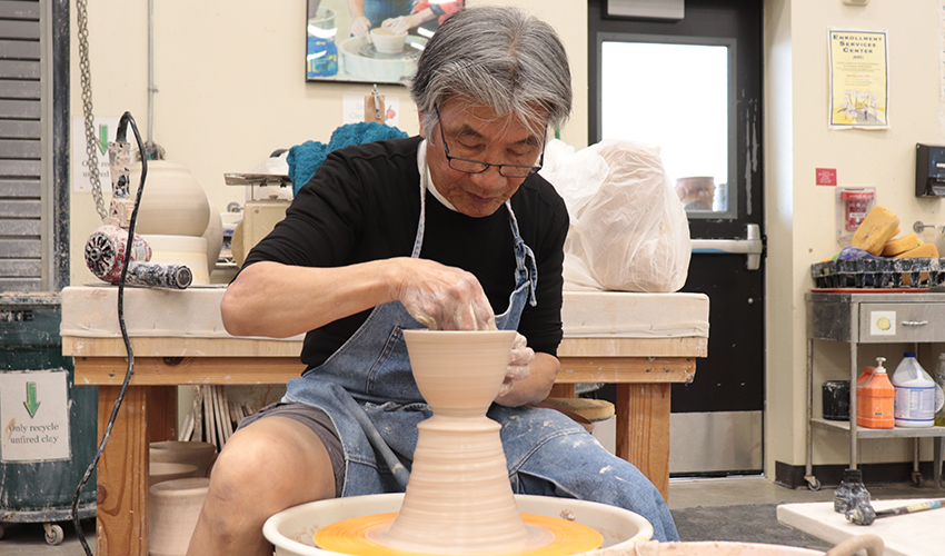Mr. V. Chin making a ceramic bowl.