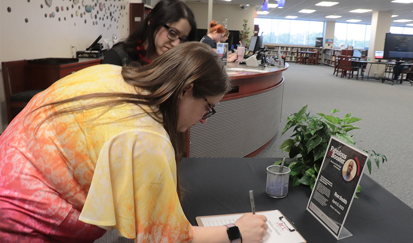 Staff signing in to Ron Smith's presentation