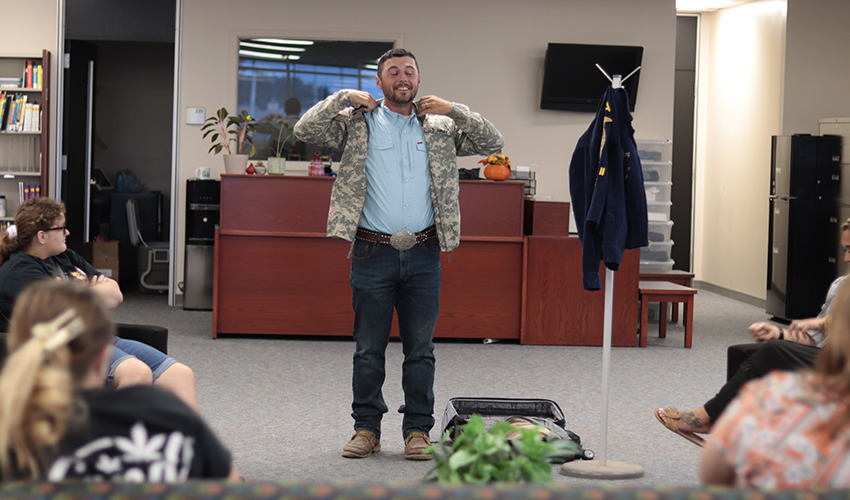 Tyler Froberg trying on a jacket.