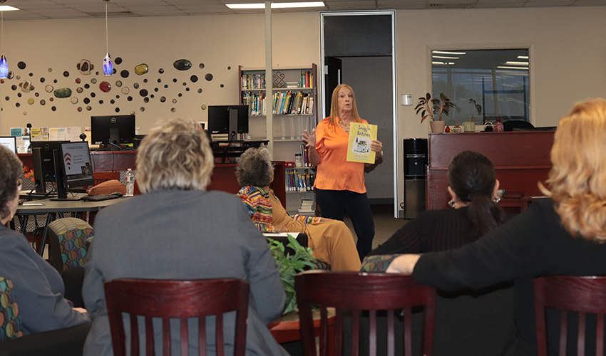 Vicki Marvel standing in front of the audience giving her presentation. 