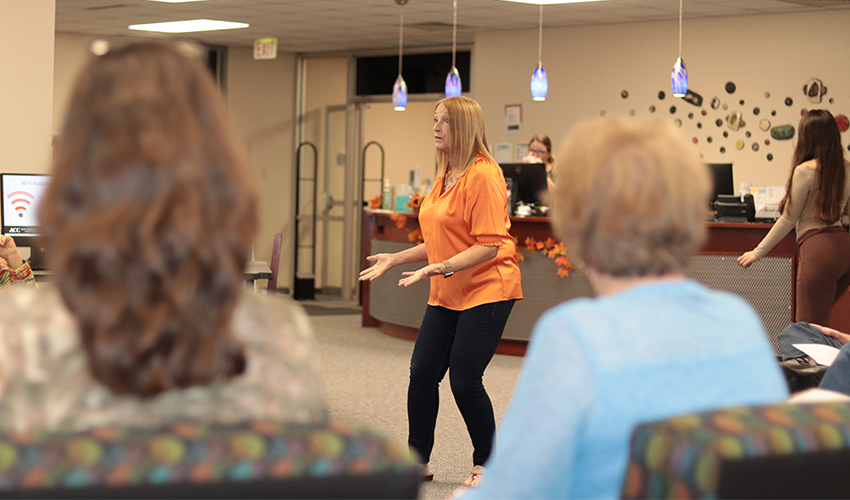 Vicki Marvel standing in front of the audience giving her presentation. 