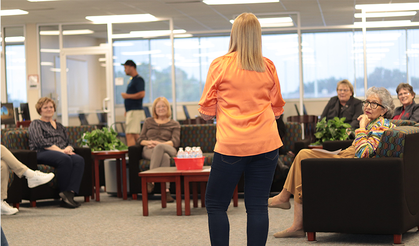 Vicki Marvel standing in front of the audience giving her presentation. 