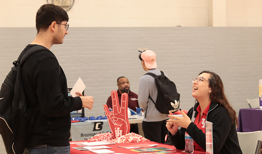 Student getting information at one of the Universities' booths.