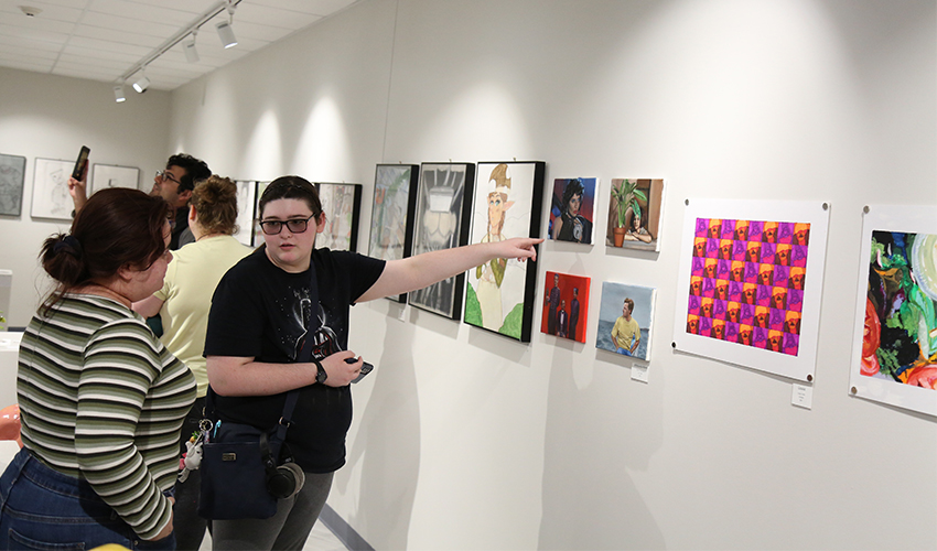 Couple of students admiring the colorful art.