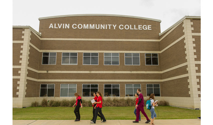 20 of 25 Picture of multiple people walking in front of S-building.