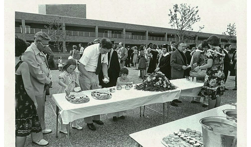 9 of 34 Picture of multiple students and teachers enjoying the snacks on ACC patio.