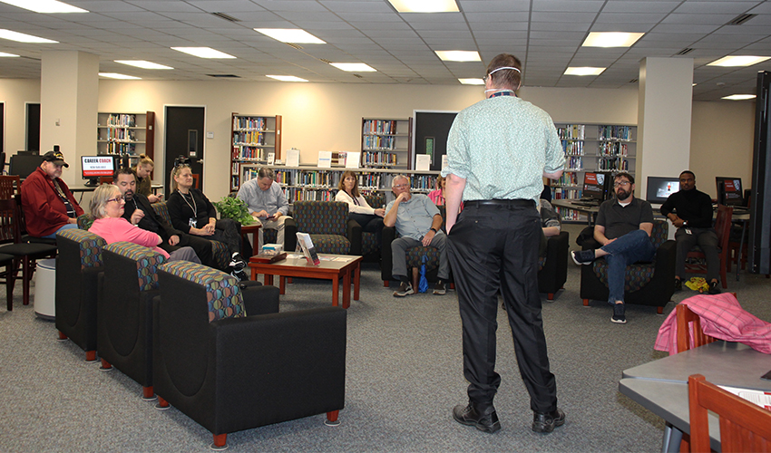 Brady Hutchison talking to the audience.