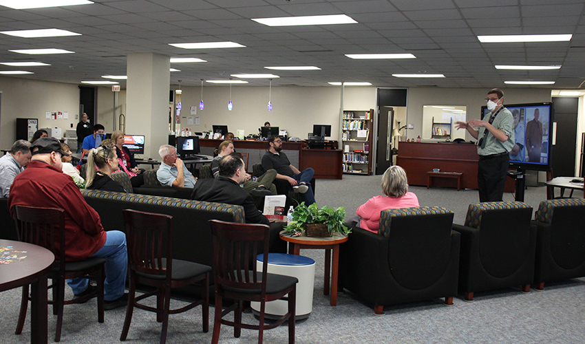 Brady Hutchison talking to the audience.