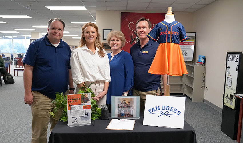 Picture of Allison Brockman with the library staff.