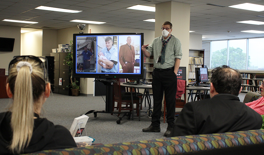 Brady Hutchison talking to the audience.