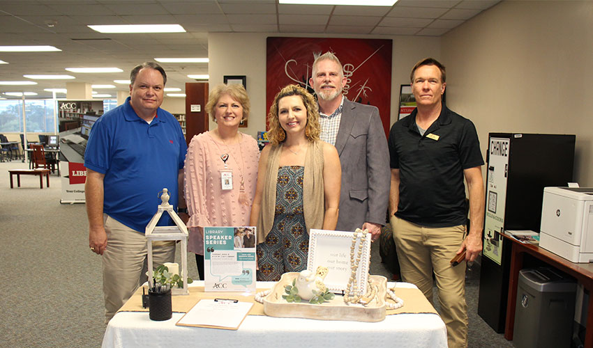 Picture of John and Shannon Moore with the library staff.