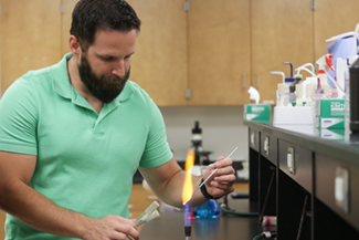 Student using bunsen burner