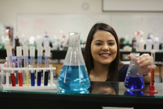 Student working with chemicals in science lab